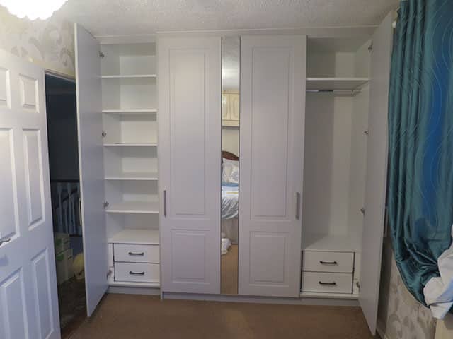 Interior of wardrobe showing drawers, hanging space and shelves