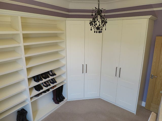 Wardrobes built around a corner and shelves for shoes